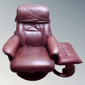 A Hjort Knudsen Burgundy leather relaxer armchair with similar stool