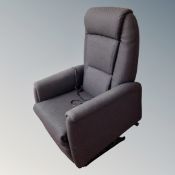 An electric reclining armchair in black fabric (continental wiring)