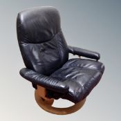 A Stressless Ekornes swivel relaxer armchair in black leather