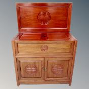 A contemporary Chinese cherry wood double door cocktail cabinet