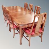 A contemporary Chinese cherry wood extending dining table, two leaves,