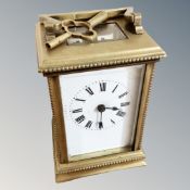 A brass cased carriage timepiece with key