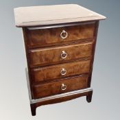 A Stag Minstrel four drawer bedside chest and a bedside stand