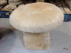A concrete garden saddle stone,
