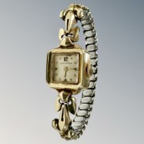 A lady's 14ct gold Longines wristwatch on plated expanding strap