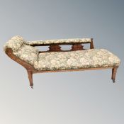 An Edwardian chaise longue in floral fabric