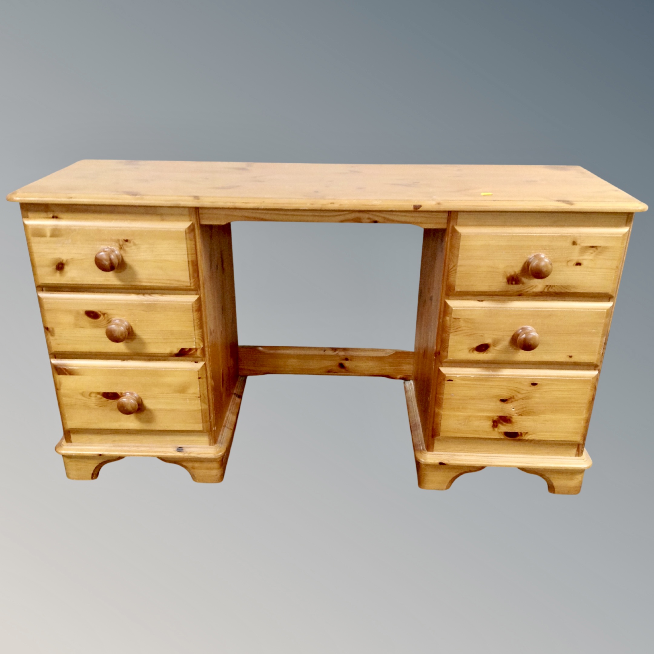A pine twin-pedestal dressing table