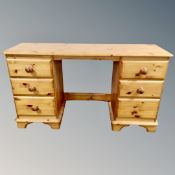 A pine twin-pedestal dressing table