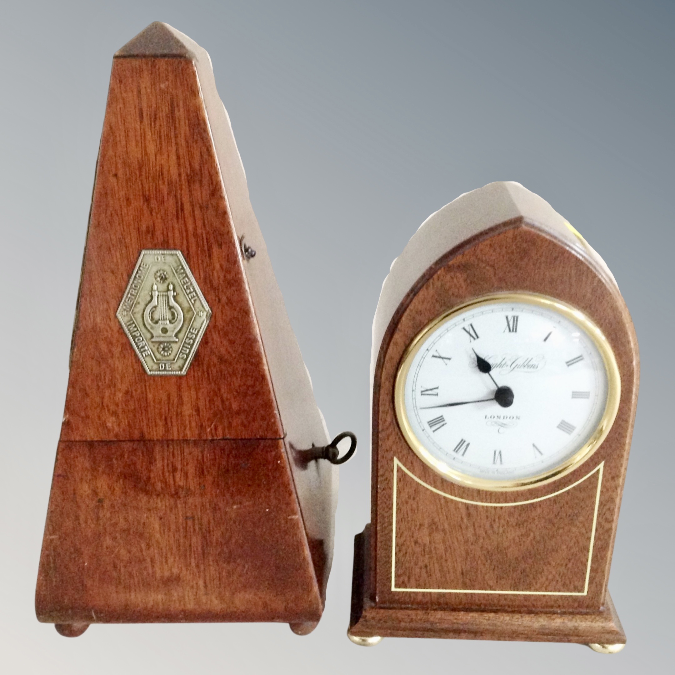 A Maelzel metronome and a battery mantel clock