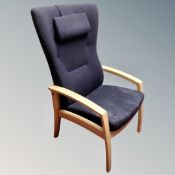 A Farstrup Mobler wood framed open armchair in charcoal coloured fabric,