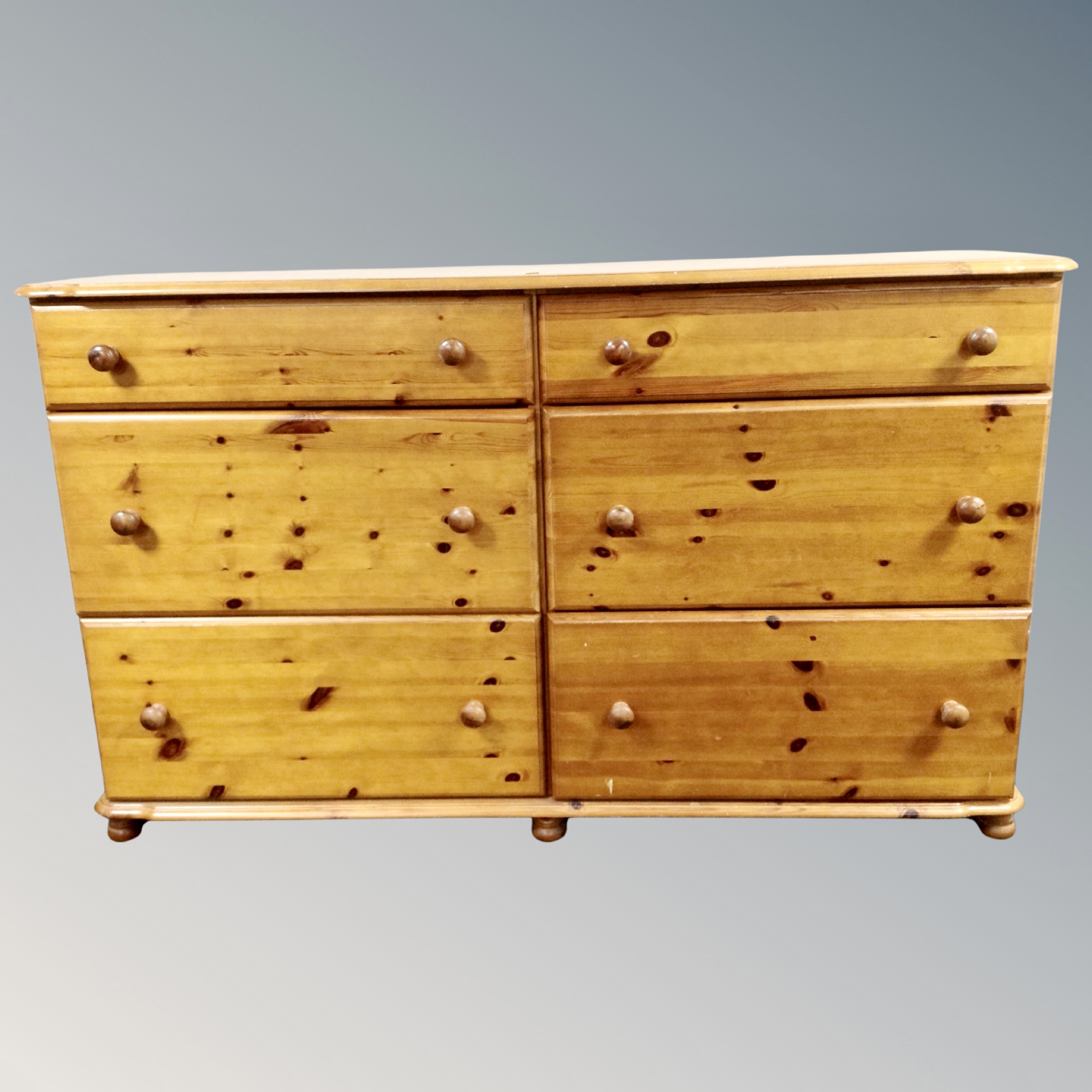 A pine six drawer block chest