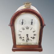 A reproduction mahogany eight day bracket clock with silvered dial,