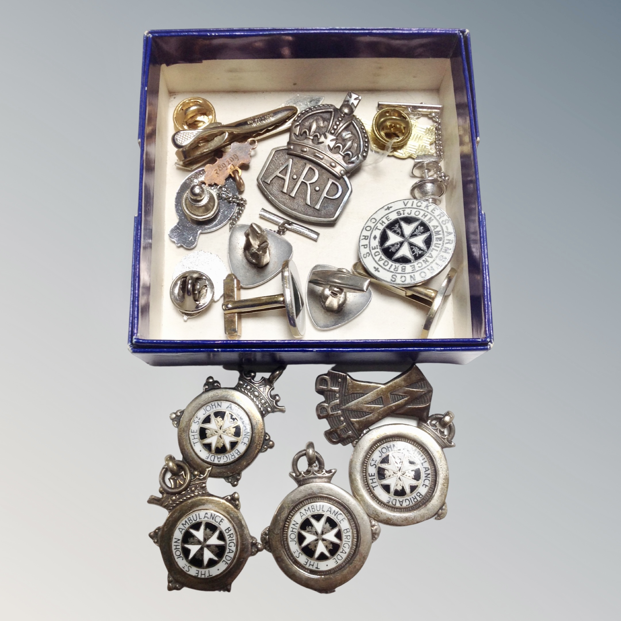 A croup of silver sporting medals, ARP badge,