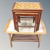 A nest of three Danish teak tiled topped tables and a tiled topped coffee table