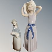 A Lladro figure of a girl number 5011 and a further figure of a girl holding a piglet