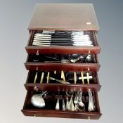 A four-division cutlery canteen containing assorted plated and stainless steel cutlery