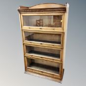 A Lebus oak four tier sectional bookcase