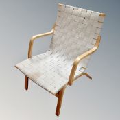 A Farstrup Mobler beech framed open armchair in webbed fabric