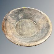 A 19th century turned wooden bowl, diameter 54 cm.