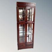 A contemporary Chinese cherry wood glazed display cabinet