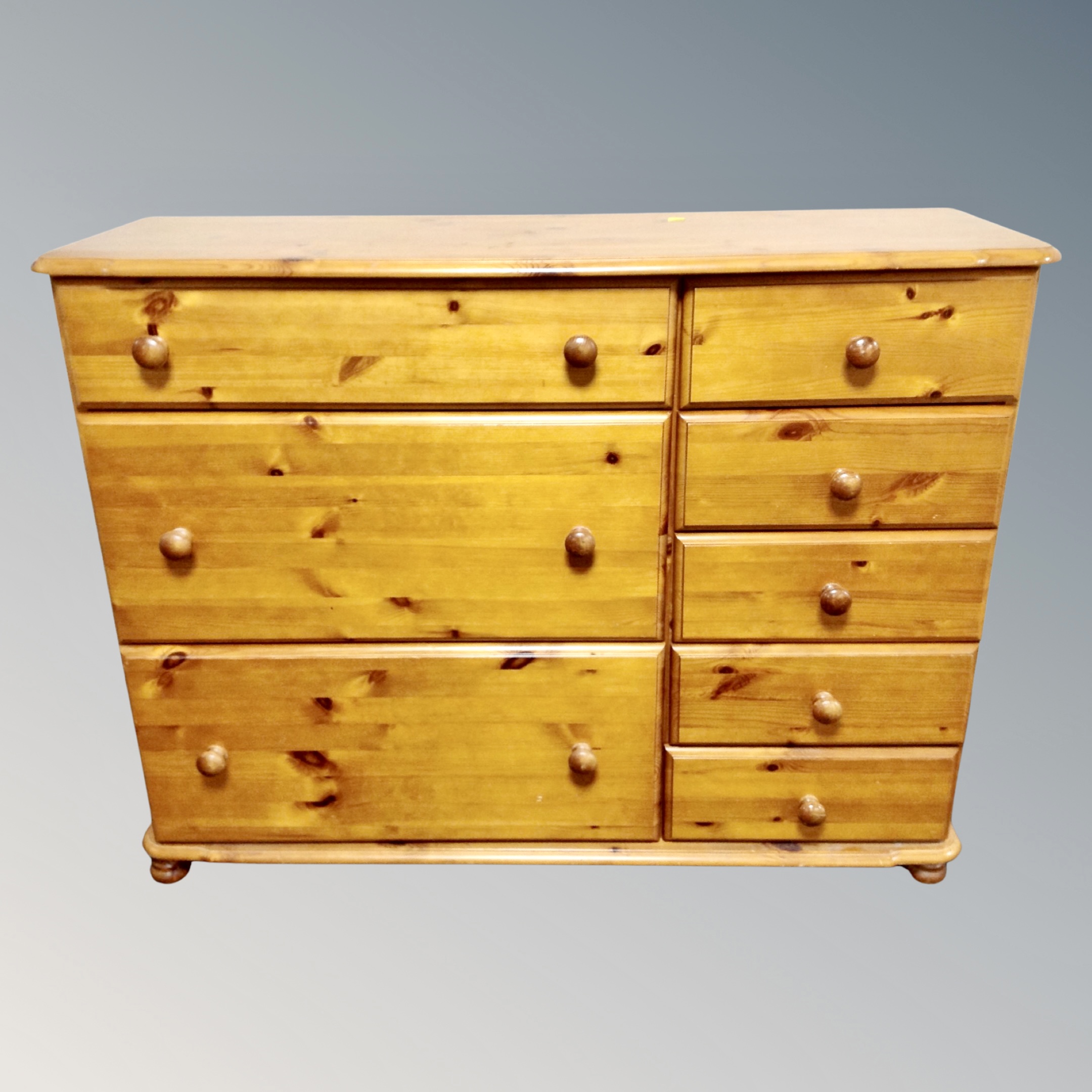 A pine eight drawer block chest