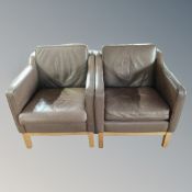 A pair of Scandinavian brown leather armchairs