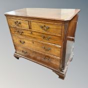 A George III mahogany five drawer chest on bracket feet (damages)