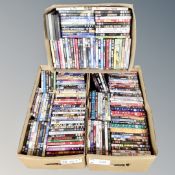 Three boxes of approximately 150 DVDs,