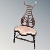 An Edwardian stained beech chair