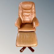 A Scandinavian swivel relaxer armchair with footstool in tan leather