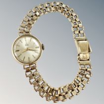 A lady's 9ct gold Tudor Royal wristwatch on 9ct gold strap, crown and strap signed Rolex,