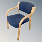 A bentwood open office armchair in turquoise fabric
