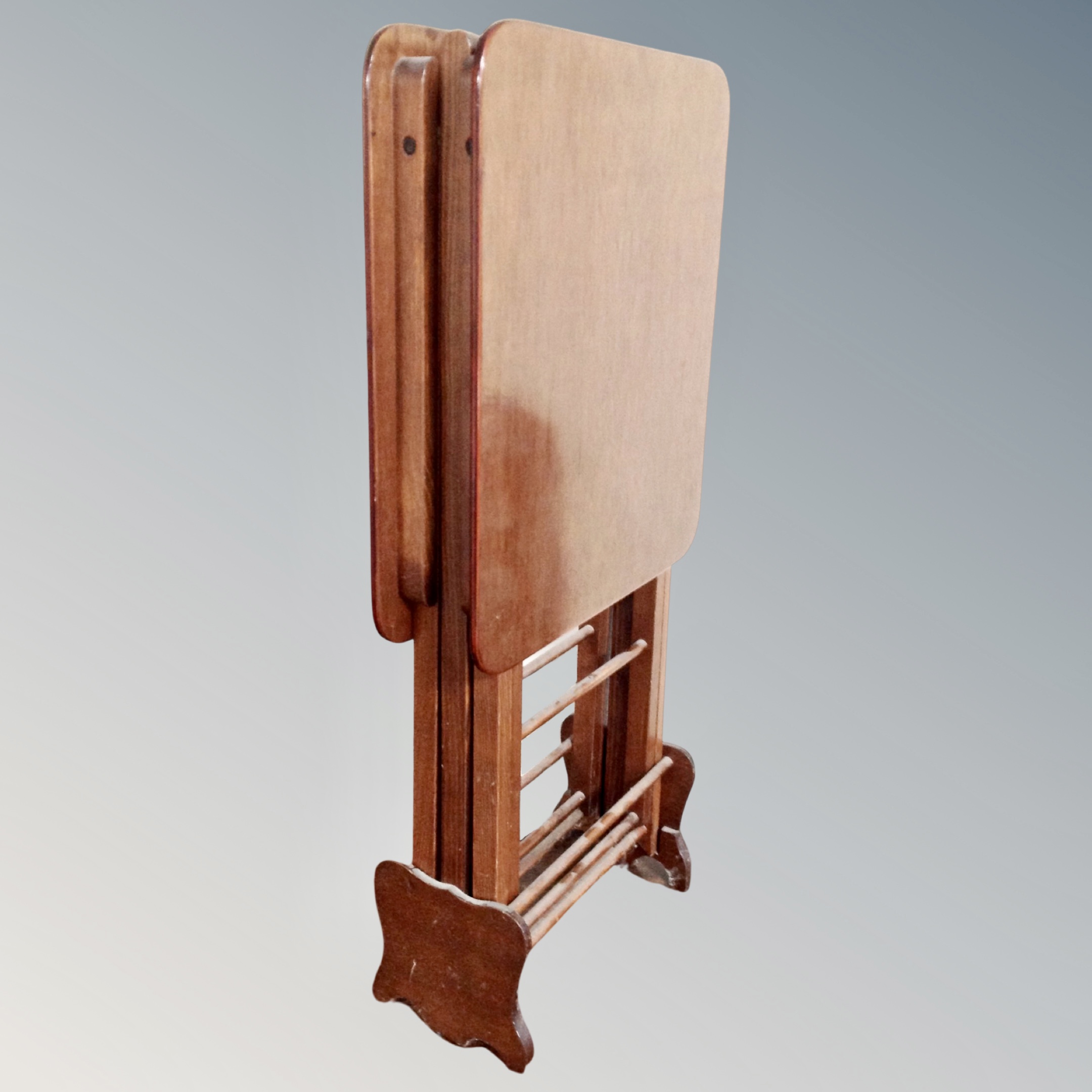 A mahogany effect folding table.