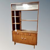 A Stonehill teak bookcase/room divider fitted cupboards and drawers