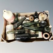 A quantity of antique glass beer bottles, stoneware bottles, stoneware ink bottles.