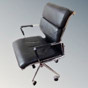 A Herman Miller style swivel office armchair in black leather