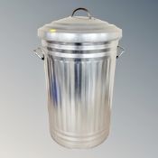 A steel bin and Next ceiling light