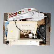 A box of Singer electric sewing machine,