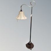 A 1930's brass rise and fall reading lamp (continental wiring)