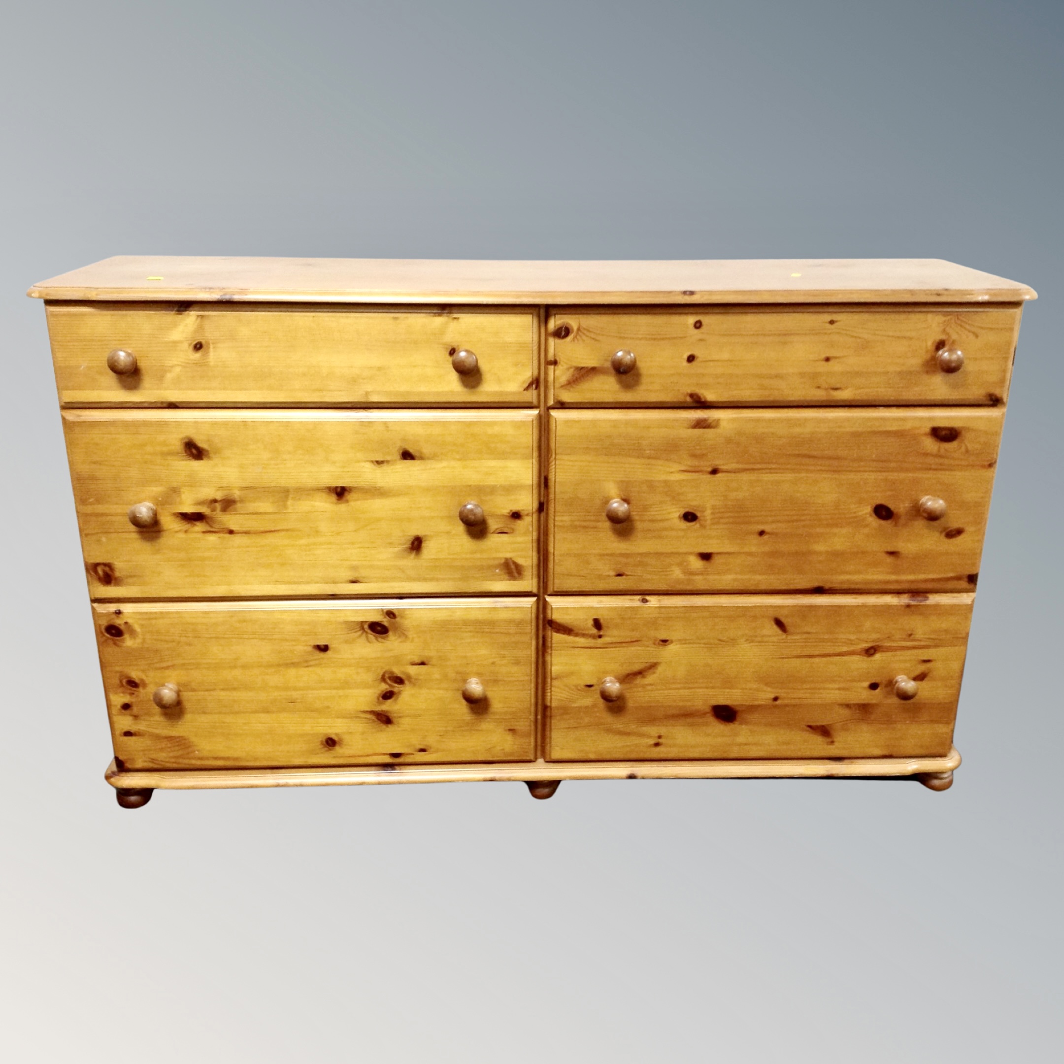 A pine six drawer block chest