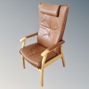 A Farstrup Mobler wood framed high backed armchair with headrest,