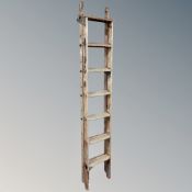 A vintage wooden folding multi purpose ladder