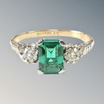 An antique 18ct gold and synthetic emerald three stone ring,
