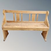 An antique pine hall bench