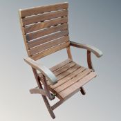 A teak slatted folding garden chair