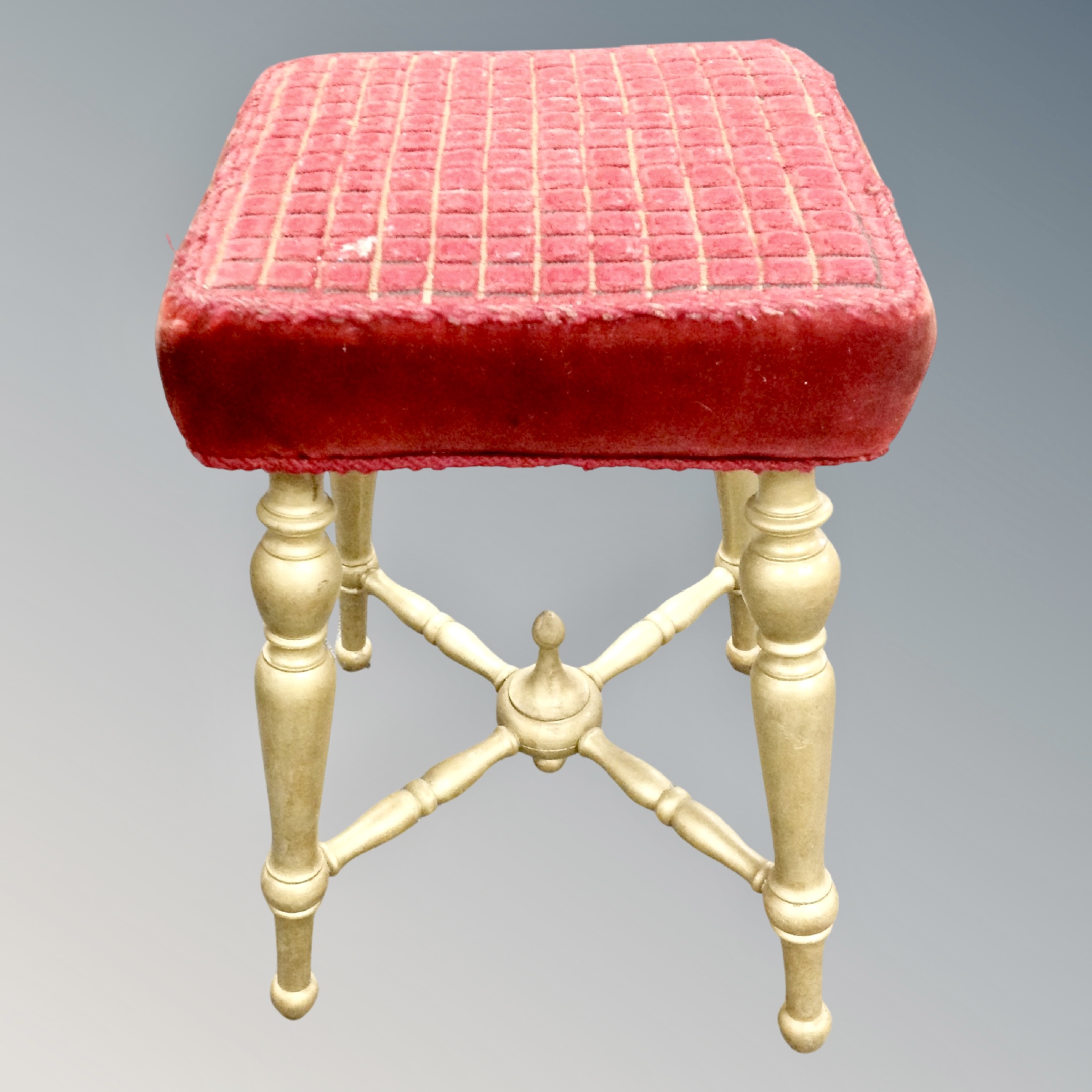 A gilt dressing table stool