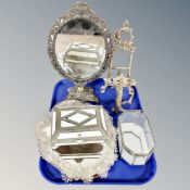 An ornate brass oval mirror, miniature brass easels, Venetian glass cartouche-shaped mirror, boxes.