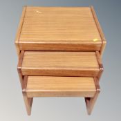 A nest of three 20th century teak tables