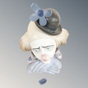 A Lladro bust of a clown (as found) CONDITION REPORT: Flower petals damaged,