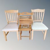 A pair of blonde oak dining chairs,